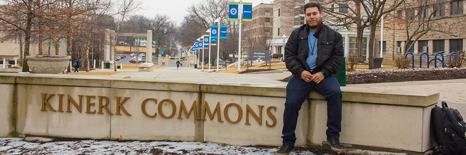 Alexis Medina sits on the Kinerk Commons ledge