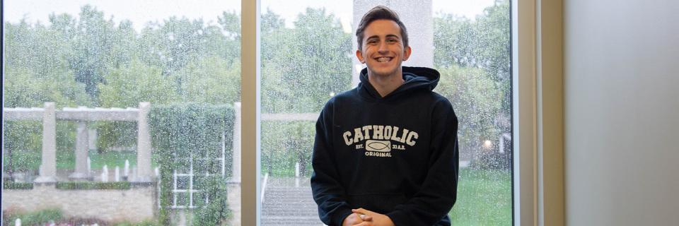Andrew Mallon, '21 Andrew sits in Arrupe