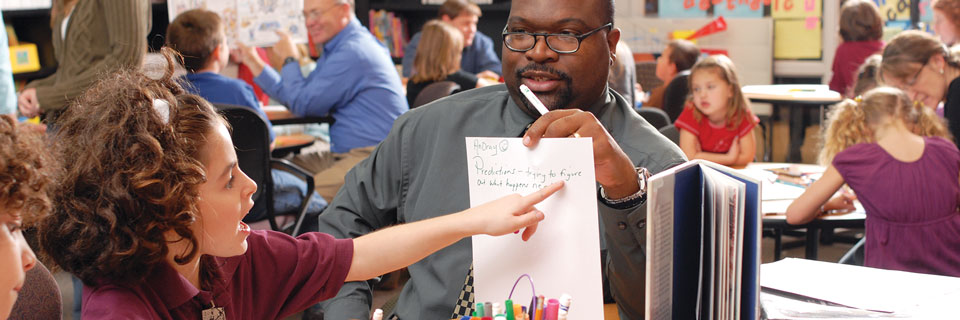 Elementary Education An Elementary Education student works with a second grader in his field placement
