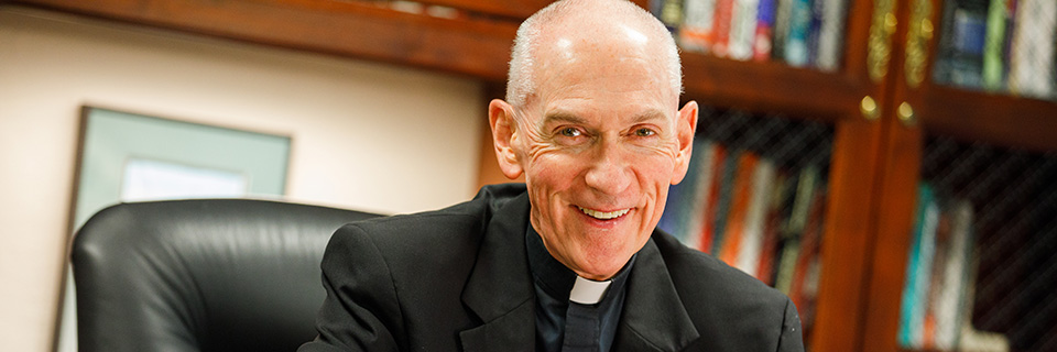 President Father Curran in his office President Father Curran