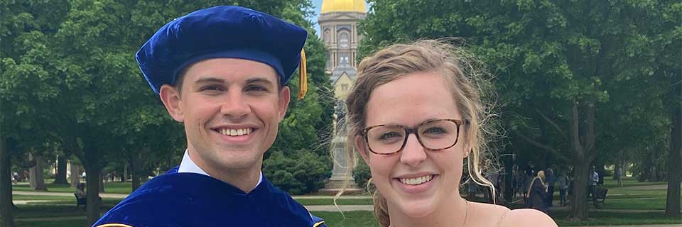 Zach and Julia Pohlman in front of the golden dome at Notre Dame