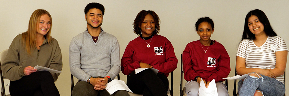 Kaylie, Damian, Bri'Yana, Naz, Rosa RockCast podcast talking about spring break, Women's History Month, and new sports on campus