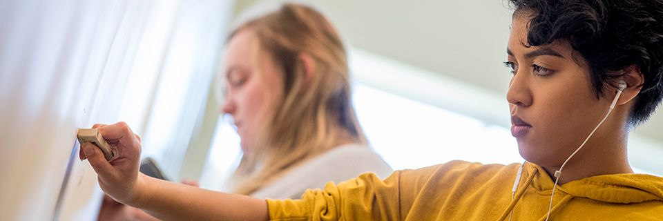 students participate in drawing activity in an art class