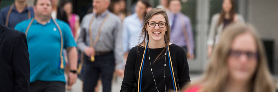 Business Administration, General Concentration Students walking on Rockhurst University campus in front of Conway Hall
