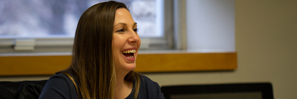 woman laughing during business class