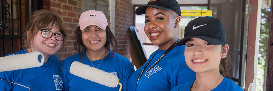 Students painting volunteering