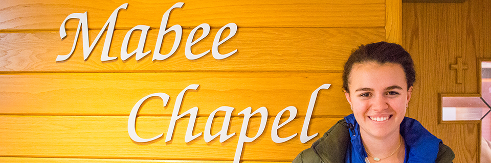 Clare Mitchell stands outside of the Mabee Chapel.