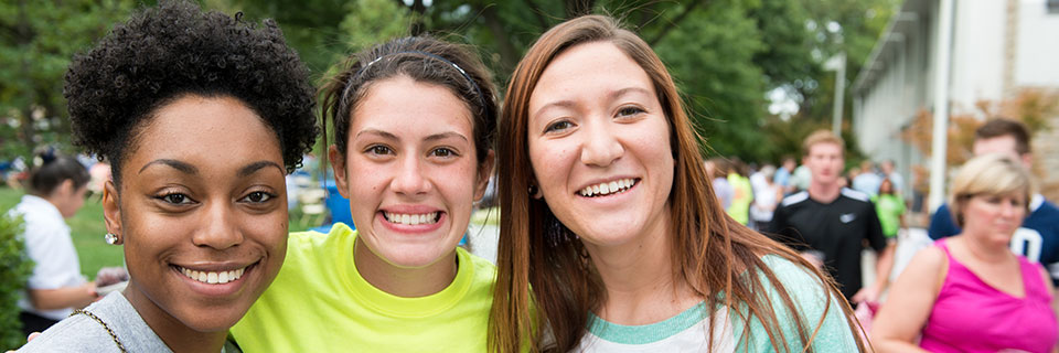 Students smiling on the quad