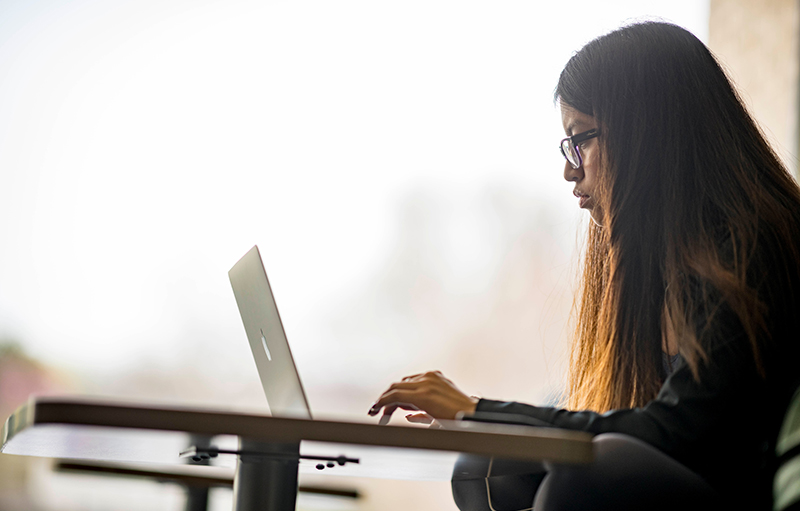 Early Acceptance Student using laptop