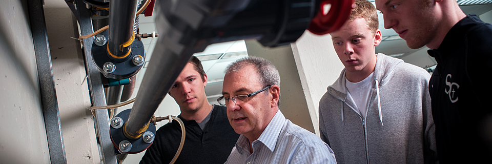 Mechanical Engineering Professor teaching students mechanical engineering