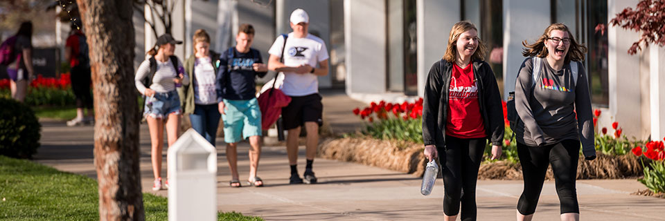 Journalism Students walking on campus quad