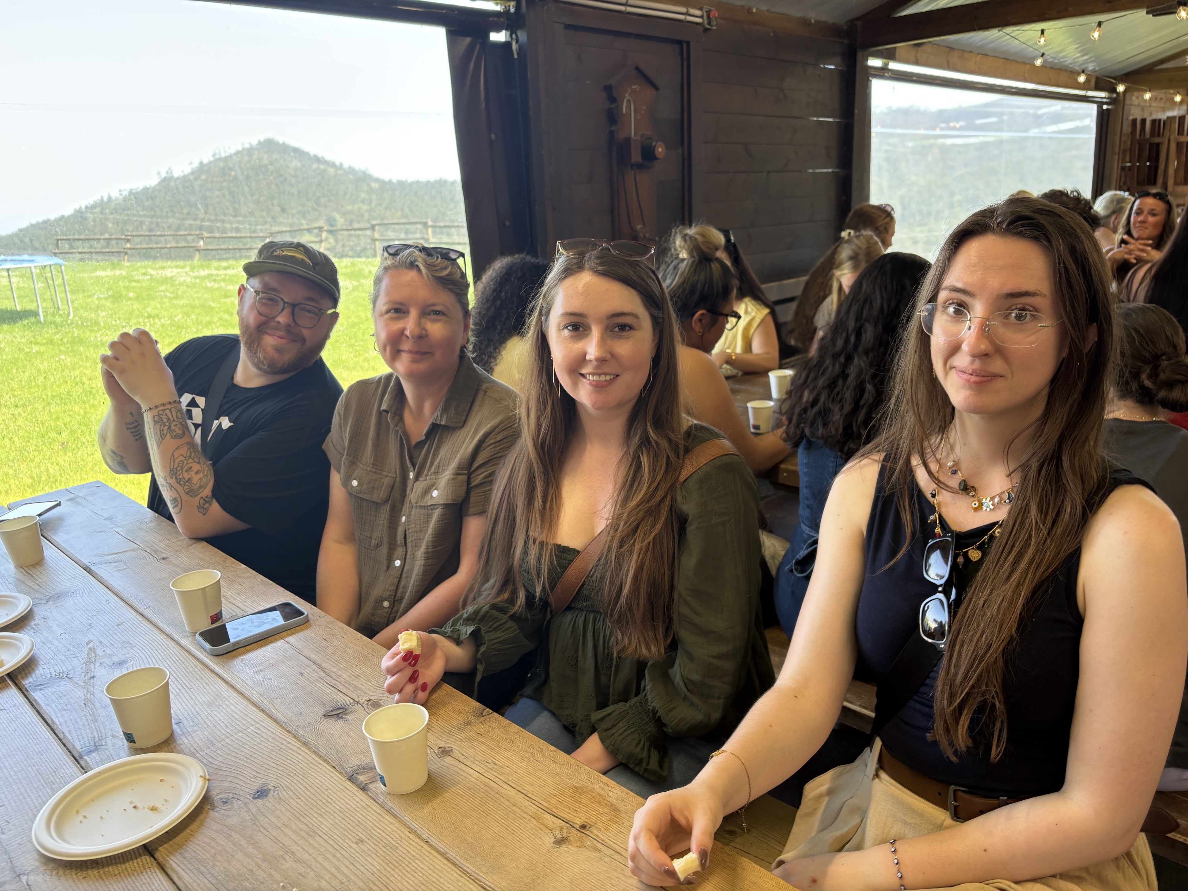Four study abroad participants sit at a table eating at Cantabria, Spain