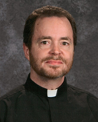 Rev. Gary E. Menard, S.J.