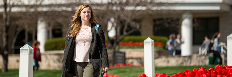 Spanish Student walking on campus