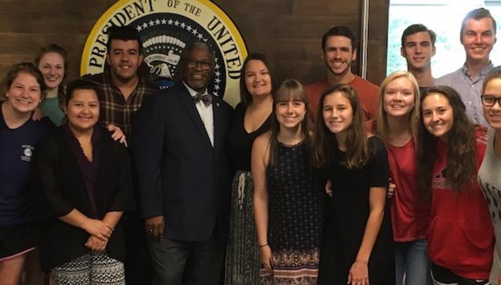 Students with Fr. Curran and Mayor Sly James
