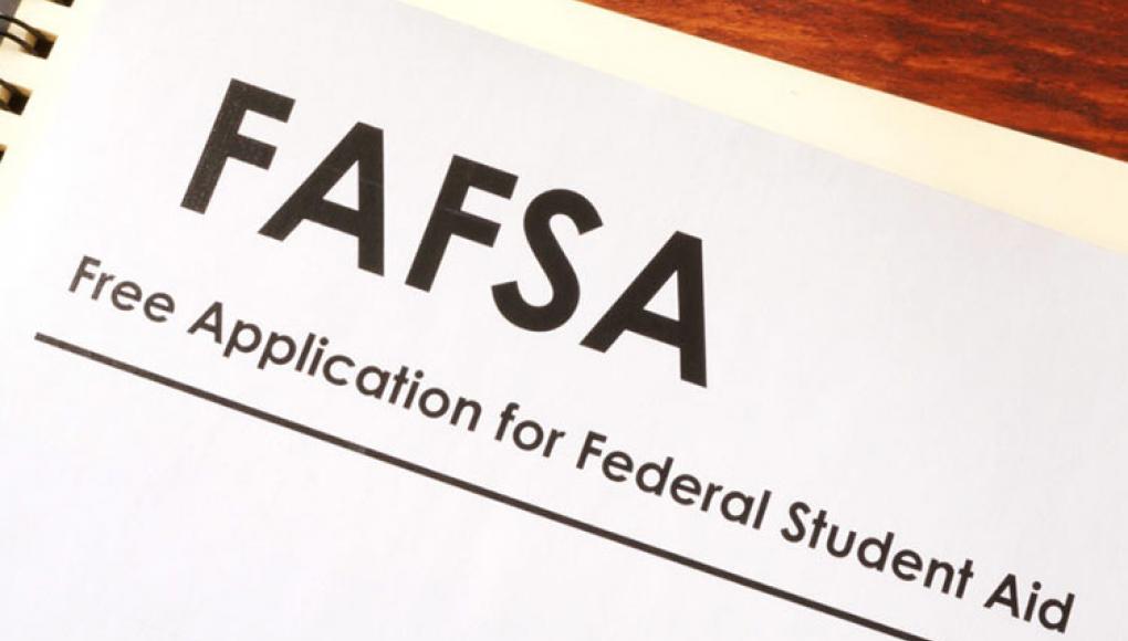 FAFSA paperwork on wood table