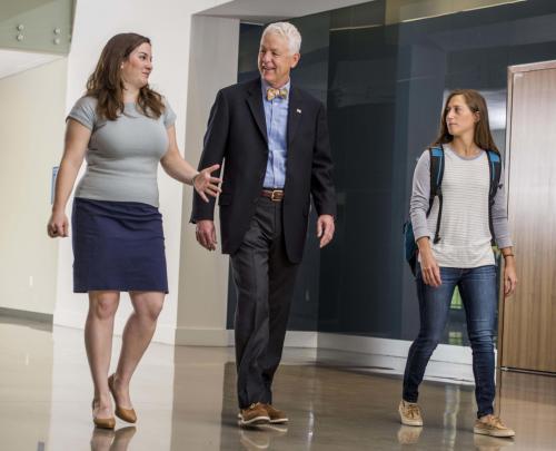 Students walking with professor in Arrupe Hall