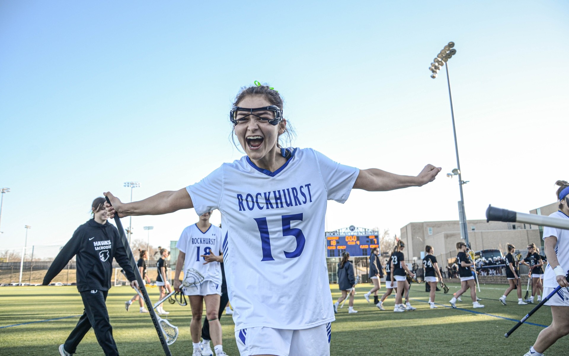 A women’s lacrosse player poses for the camera