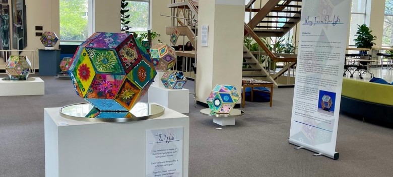 Gallery of artwork on display in the lobby of the Greenlease Library