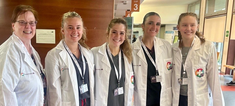 Students stand next to an instructor during the One Health Initiative trip abroad.