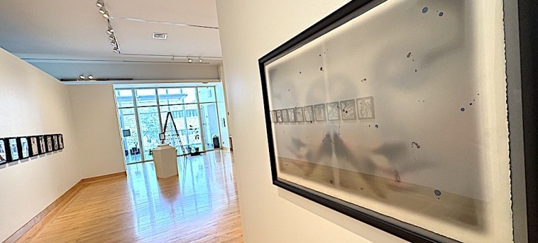 Flat Files exhibit, with print by artist Hugh Merrill in the foreground.