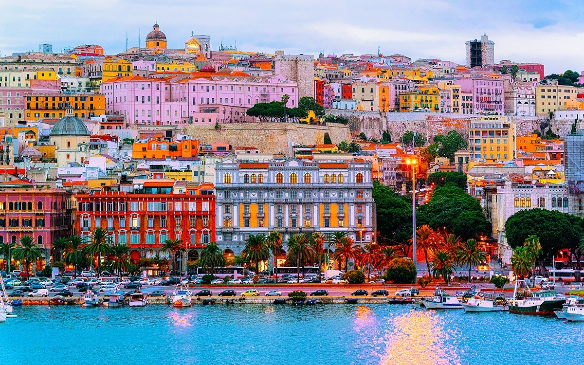 Aerial view of Cagliari, Italy's colorful buildings as seen from the water