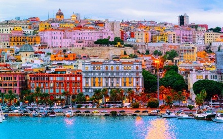 Aerial view of Cagliari, Italy's colorful buildings as seen from the water