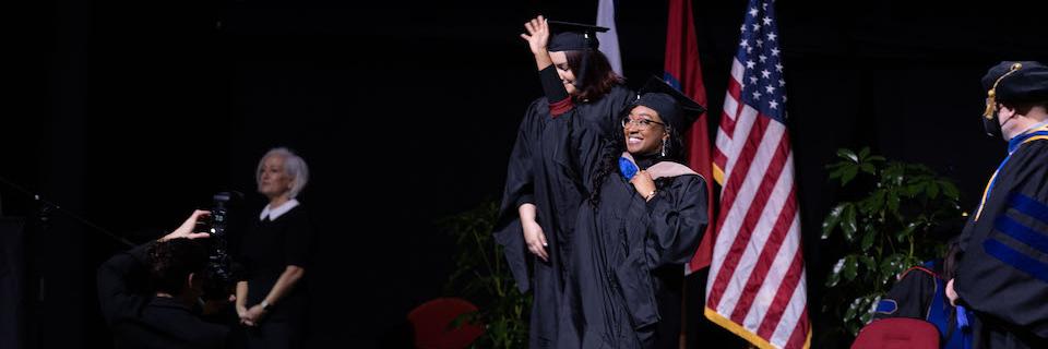 Student receiving her degree at commencement