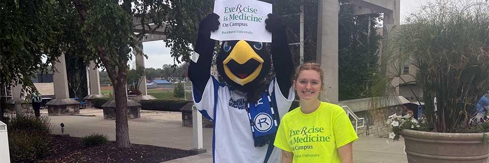 Rock E. Hawk and an Exercise is Medicine - On Campus student