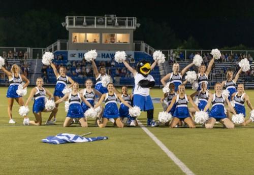 Rock E. Hawk and the Spirit Squad on the field