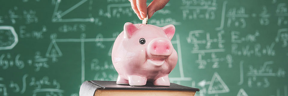 Tuition & Fees Piggy bank in front of chalkboard