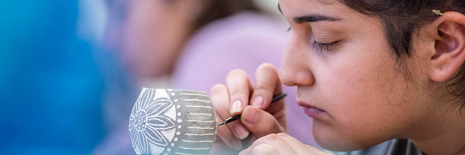 Student painting ceramics